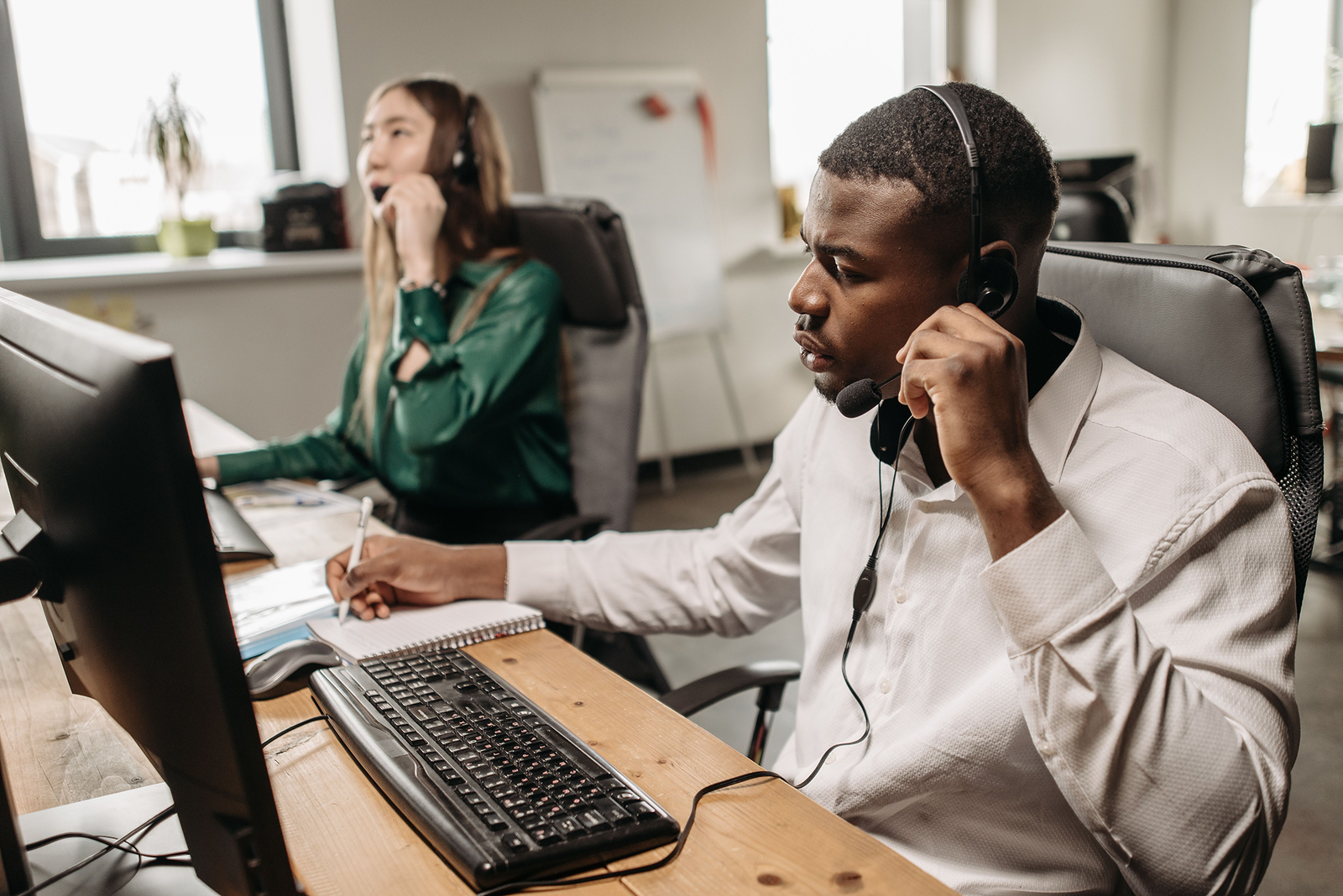 Professional customer support team working with digital technology